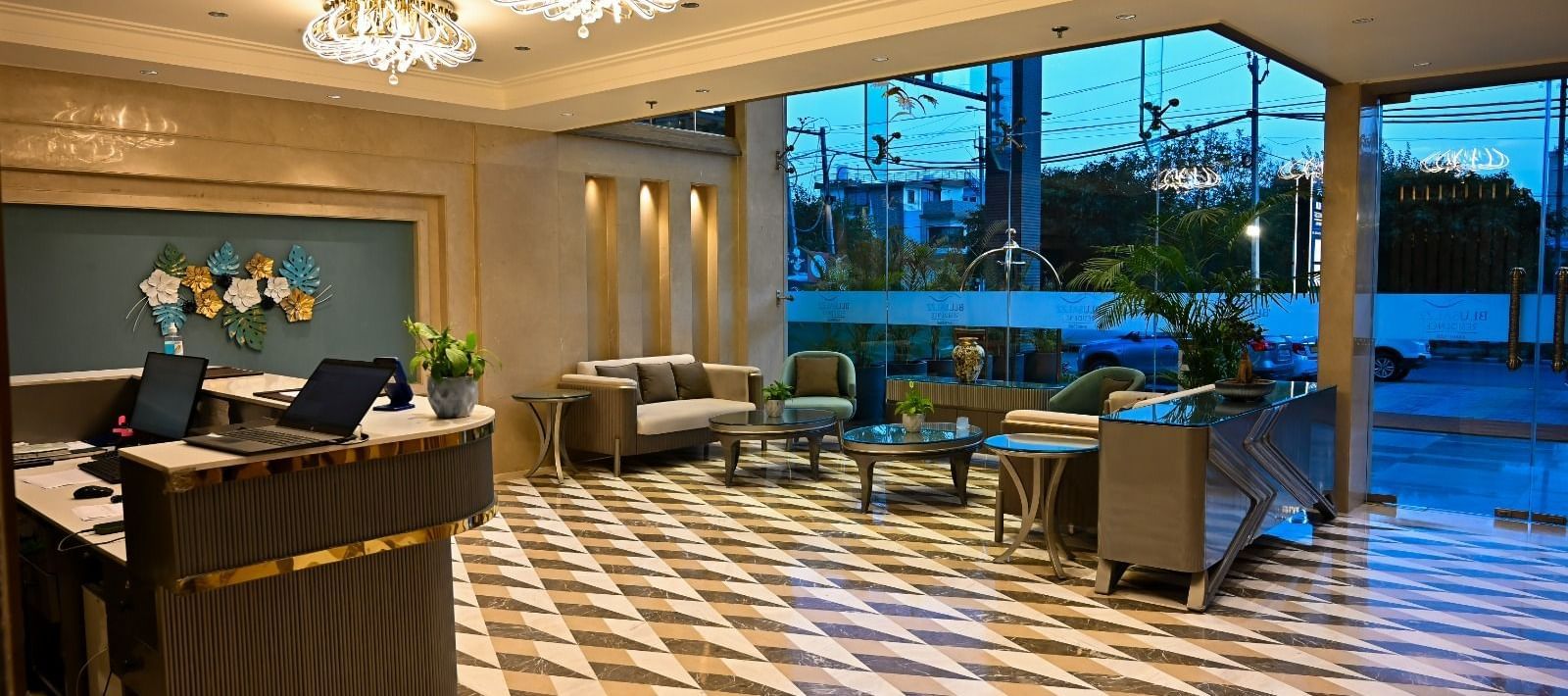 A spacious lobby featuring comfortable seating arrangements and a reception desk at 